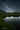 Hochformatiges Foto der Milchstrasse über einem See, © David Dunand